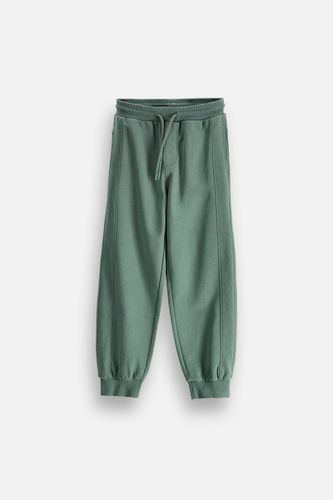 COCCODRILLO COCCODRILLO Spodnie dresowe JOGGER zielone z wiązaniem w pasie o fasonie SLIM rozmiar 134 dla chłopca
